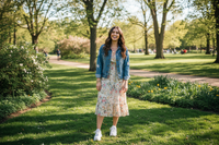 okay it sjust her in a park looking happy 